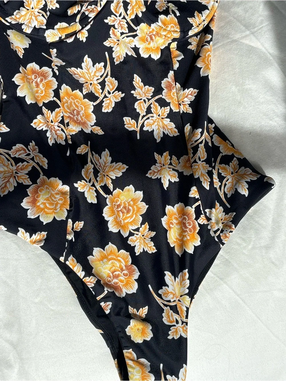 Auguste The Label Black One-Piece Bodysuit with Yellow Floral Print